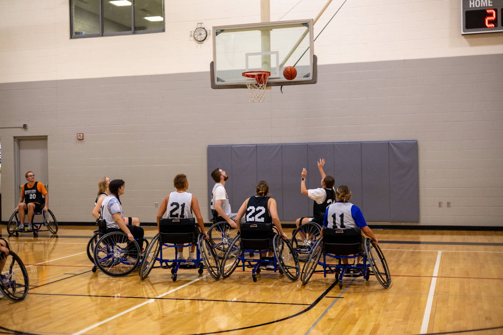 Students playing wheelchair basketball at an adaptive sports intramural sporting event